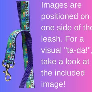 May include: A dog leash with a blue and green patterned ribbon, featuring cartoon images, attached to a purple strap. The leash has a silver-colored metal clasp. Text on the image reads: Images are positioned on one side of the leash.