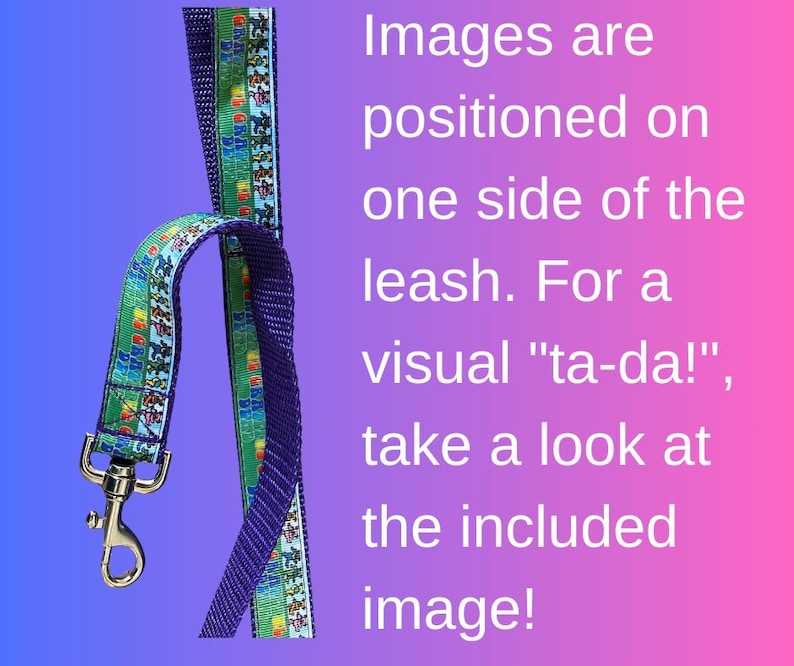 May include: A dog leash with a blue and green patterned ribbon, featuring cartoon images, attached to a purple strap. The leash has a silver-colored metal clasp. Text on the image reads: Images are positioned on one side of the leash.
