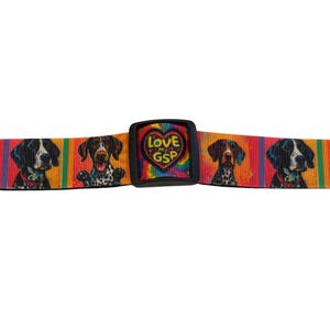 May include: A colorful dog collar featuring a repeating pattern of German Shorthaired Pointers on a rainbow striped background. The collar has a black plastic buckle with a heart-shaped design that reads "Love My GSP".