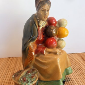 Chalkware Figure of Woman Balloon Seller. Plaster Figurine of Balloon Seller