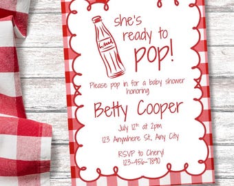 May include: A baby shower invitation with a red and white gingham border. The invitation features the text "she's ready to pop!" and includes details for the event, such as the honoree's name, date, time, and location.