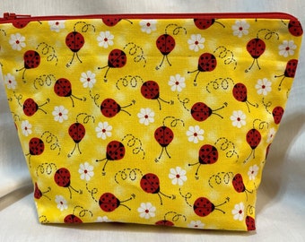 Ladybug Makeup/Travel/Cosmetic Bag with Red Ladybugs on a Yellow background with Flowers