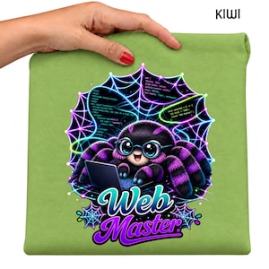 May include: A light green t-shirt featuring a graphic of a fuzzy purple and black spider wearing glasses while typing on a laptop. The spider is centered within a glowing neon spiderweb background with code snippets and the text Web Master.