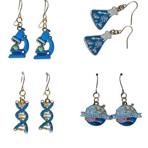 May include: A collection of four pairs of science-themed earrings. The earrings feature designs of microscopes, Erlenmeyer flasks, DNA strands, and chemistry-themed globes. Each pair has a gold-colored hook and is brightly colored with blue, white, pink, and yellow.
