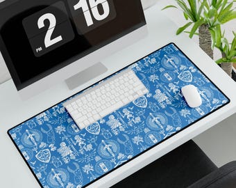 May include: A blue and white patterned mousepad with a keyboard and a white mouse on top. The mousepad features a design of various symbols and characters from the Legend of Zelda video game series.