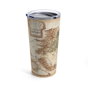 May include: A stainless steel travel tumbler with a map of Rohan from The Lord of the Rings. The map is in shades of brown and green with the word "Rohan" in a banner at the top.