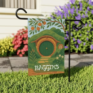 May include: A green door with a round frame is set into a brick hobbit house with a brown roof. The house is surrounded by green grass and a tree with orange fruit. The text "Baggins" is printed below the door.