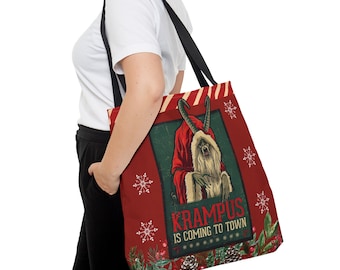 May include: Red tote bag with a vintage illustration of Krampus in a red robe and horns, and the text "Krampus is Coming to Town." The bag has black straps and a festive design with snowflakes and greenery.