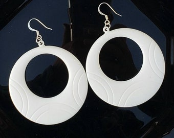 Vintage white hoop earrings with swirl design