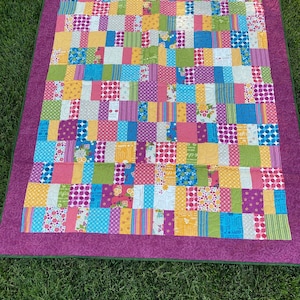 Bright floral and polka dot quilt
