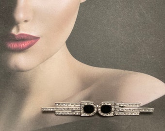 Antique black onyx brooch with marcasite highlights. a long brooch classy in every way. hollywood glam!