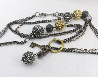 Mixed metals long necklace gunmetal and gold beads with key charms