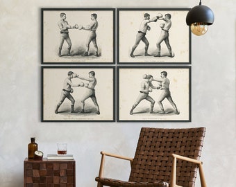 May include: A home office featuring a brown leather desk chair, a black metal desk with a framed picture and a lamp, a brown leather chair, a brown wooden side table with a bottle and a glass, a brown leather ball, and four black framed prints depicting boxing poses.