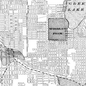 May include: A black and white map of a city with the names of parks and streets labeled. The map shows the location of Woodland Park, Green Lake, and Monona Bay.