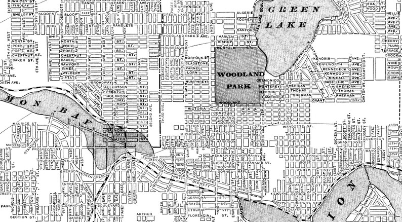 May include: A black and white map of a city with the names of parks and streets labeled. The map shows the location of Woodland Park, Green Lake, and Monona Bay.