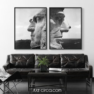 May include: A black and white photograph of two men working on Mount Rushmore. The men are hanging from ropes and appear to be cleaning the face of George Washington. The photo is split into two frames.
