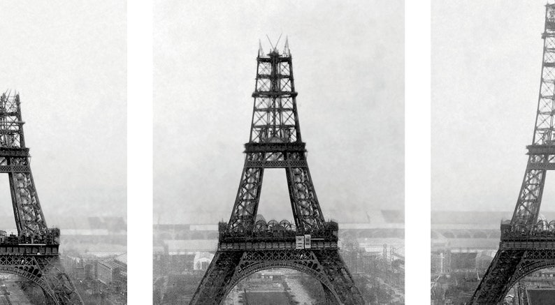 May include: Black and white photograph of the Eiffel Tower under construction. The iconic wrought-iron lattice tower is partially built, with visible scaffolding and construction elements. The image captures the tower's intricate design and the surrounding cityscape.
