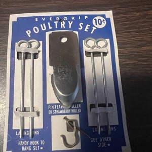 May include: Vintage Evergrip poultry set on a blue and white card. The set includes a pin feather puller, two metal skewers, and a hook. The card reads "Handy Hook to Hang Set" and "Pin Feather Puller or Strawberry Huller."