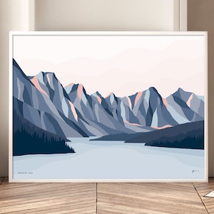 May include: A framed print of a minimalist landscape illustration featuring a blue lake surrounded by a range of blue and pink mountains. The text "SPRINGS LAKE, CANADA" is at the bottom of the print.