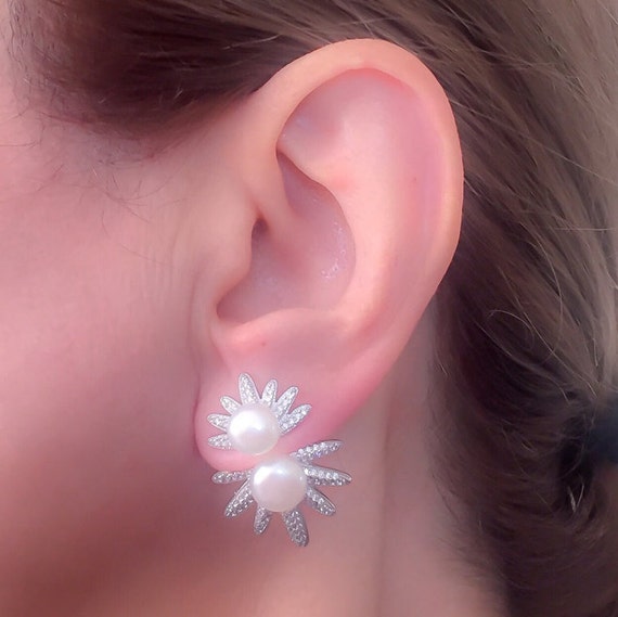 pearl earrings on ear