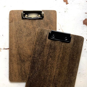 dark brown wood clipboard, walnut finish, with modern, low profile, antique brass or black clips. Made to order for any paper size.