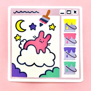 May include: A square sticker featuring a digital art interface with a pink rabbit sitting on a white cloud. The scene includes a yellow crescent moon, purple and yellow stars, and a paintbrush. A sidebar displays four paint buckets in yellow, pink, purple, and green.
