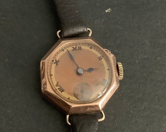 Ladies rose 9ct   gold watch on leather strap