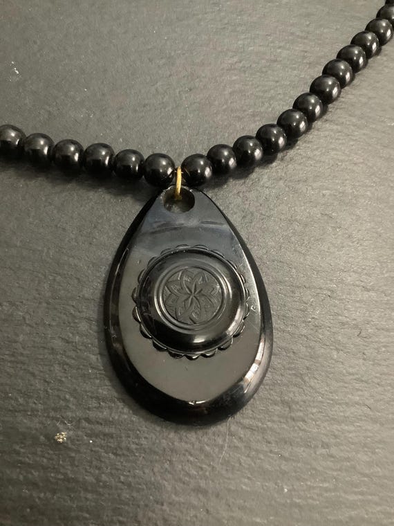 Whitby jet pendant on beads