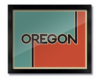 May include: A framed print with a retro design featuring the word "OREGON" in bold black letters against a teal and orange background.