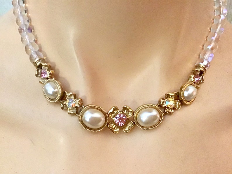 Lovely necklace. 1928 bib necklace Clear beads and white cabs with goldtone metal flowers and colored rhinestones