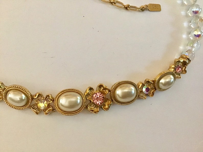 Lovely necklace. 1928 bib necklace Clear beads and white cabs with goldtone metal flowers and colored rhinestones