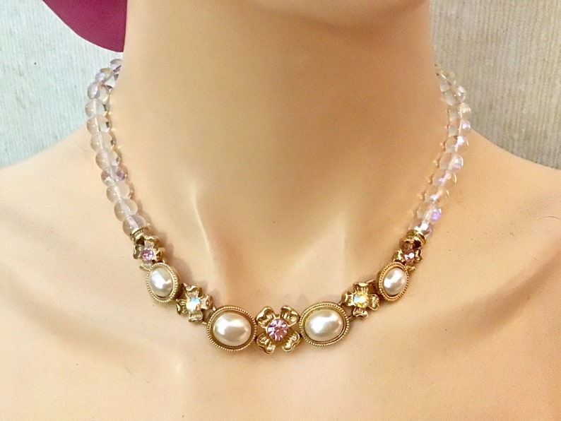 Lovely necklace. 1928 bib necklace Clear beads and white cabs with goldtone metal flowers and colored rhinestones