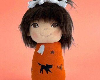 Halloween Fabric Swaddle Doll, 10”Soft Rag Doll with embroidered face, Halloween doll, Orange Knit Fabric with Ghosts, Cats and spiders