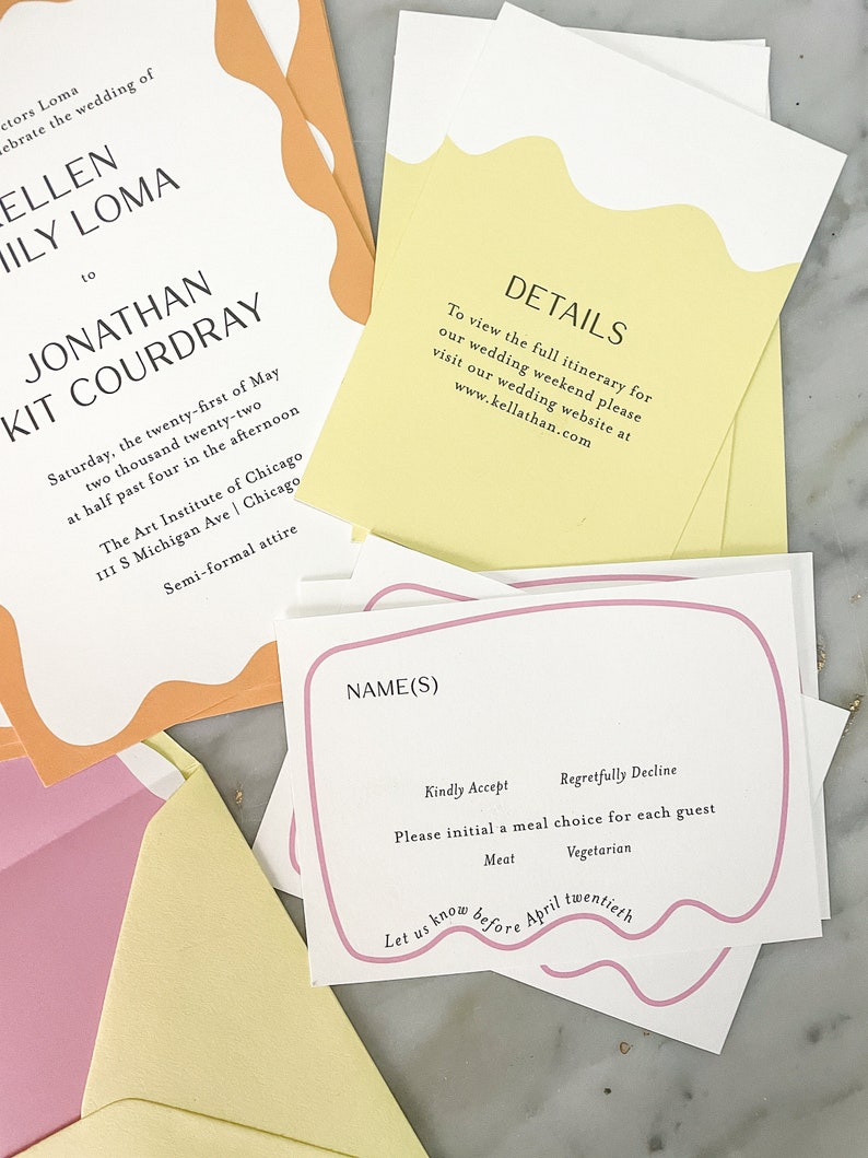 May include: A pink and white RSVP card with a pink border and a wavy design. The card has the text "NAME(S)" at the top and includes options for guests to indicate their meal choice: "Kindly Accept" or "Regretfully Decline". The card also includes the text "Let us know before April twentieth".
