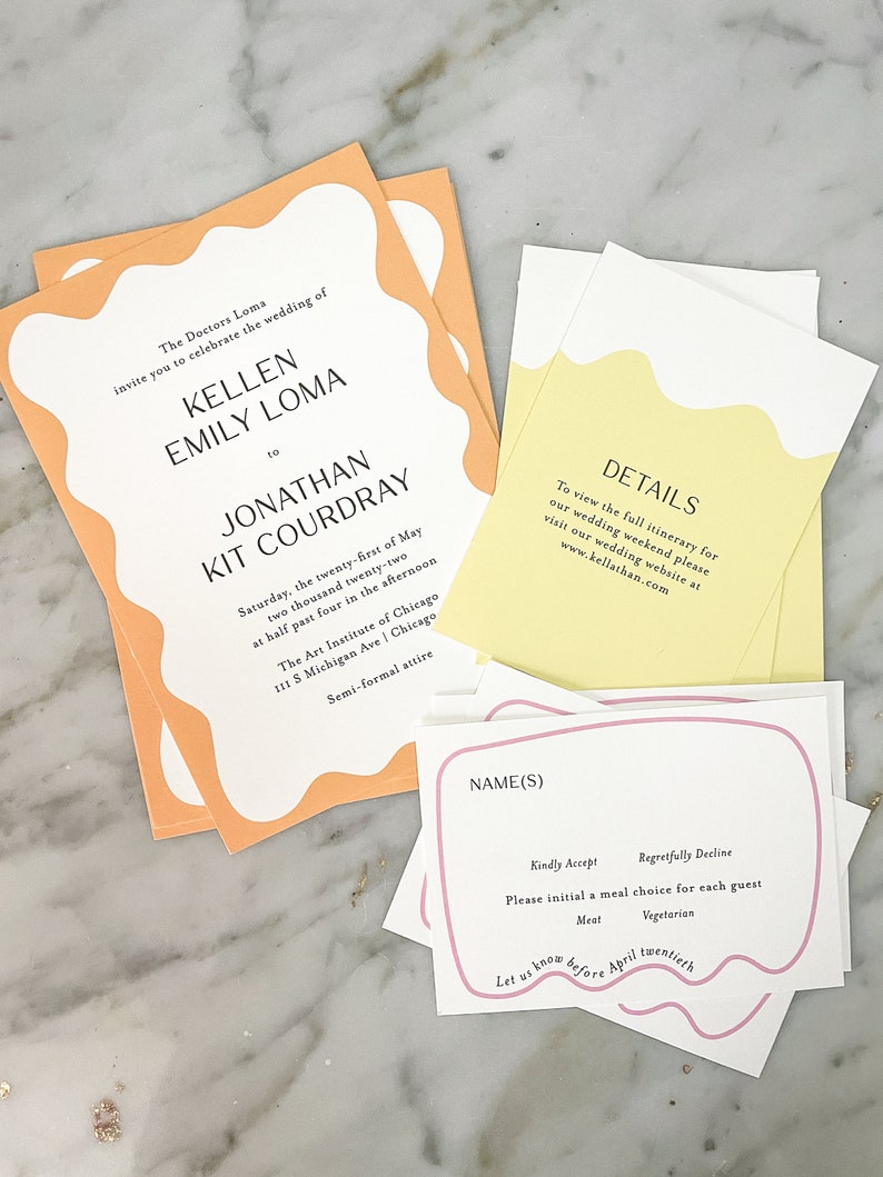May include: Wedding invitation suite with a peach and yellow color scheme. The invitation features a white background with black text and a peach border. The RSVP card features a pink border and white text. The text on the invitation reads "The Doctors Loma invite you to celebrate the wedding of Kellen Emily Loma to Jonathan Kit Courdray Saturday, the twenty-first of May two thousand twenty-two at half past four in the afternoon The Art Institute of Chicago 111 S Michigan Ave | Chicago Semi-formal attire". The text on the RSVP card reads "Name(s) Kindly Accept Regretfully Decline Please initial a meal choice for each guest Meat Vegetarian Let us know before April twentieth".