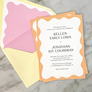 May include: A peach-colored wedding invitation with a white border and a wavy edge. The invitation announces the wedding of Kellen Emily Loma and Jonathan Kit Courdray on Saturday, May 21, 2022 at 4:30 PM at The Art Institute of Chicago. The dress code is semi-formal attire.