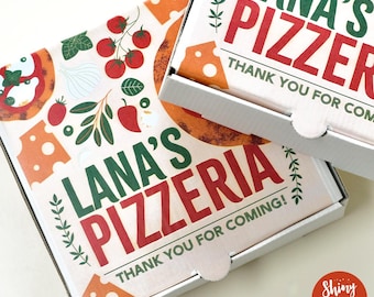May include: Two white pizza boxes with a green and red design. The top box says "Lana's Pizzeria" and "Thank You For Coming!" The bottom box says "Lana's Pizzer" and "Thank You For Coming!"