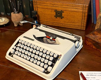 A beautiful Hermes Typewriter in all-white! Swiss-made for precision and quality. Fully reconditioned and ready to carry anywhere!