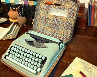 Classic Hermes Baby typewriter, with rare deLuxe Plaid case! QWERTY Keyboard. 1958. Extraordinarily fine condition and ready to travel!
