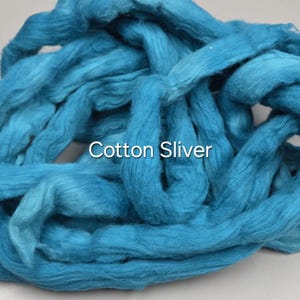 May include: A close-up of a pile of vibrant turquoise cotton sliver. The text "Cotton Sliver" is displayed in white. The fibers are loosely arranged, creating a soft, textured appearance, ideal for crafting and textile projects.