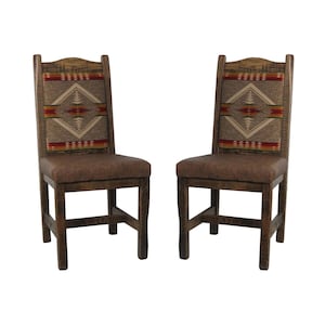 May include: Two wooden chairs with brown upholstered seats and high backrests. The backrests feature a central panel with a geometric diamond pattern in shades of red, orange, yellow, and tan, framed by dark wood grain vertical supports and legs.