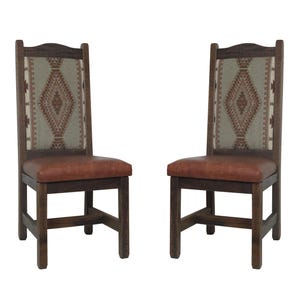 May include: Two wooden dining chairs with a rustic design. The chairs have a dark brown frame, a brown leather seat, and a patterned fabric backrest in shades of brown, tan, and green. The chairs are set against a white background.
