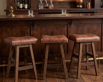 Taburete de bar giratorio con asiento de cuero y base tipo silla de montar de 76 cm (30").