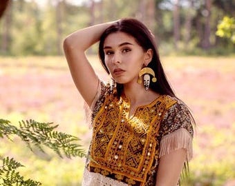 African Statement earrings with raw hammered brass crescent and bone batik pendant