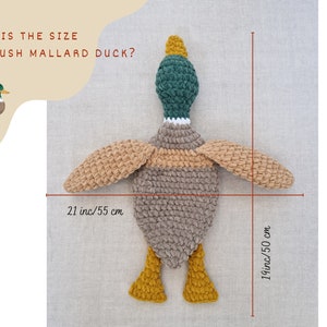 May include: A plush mallard duck toy with brown, beige, green, and yellow crocheted fabric. The duck is 21 inches long and 19 inches tall.
