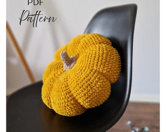 Schema per cuscino a zucca all'uncinetto: cuscino autunnale a maglia grossa (schema in PDF)