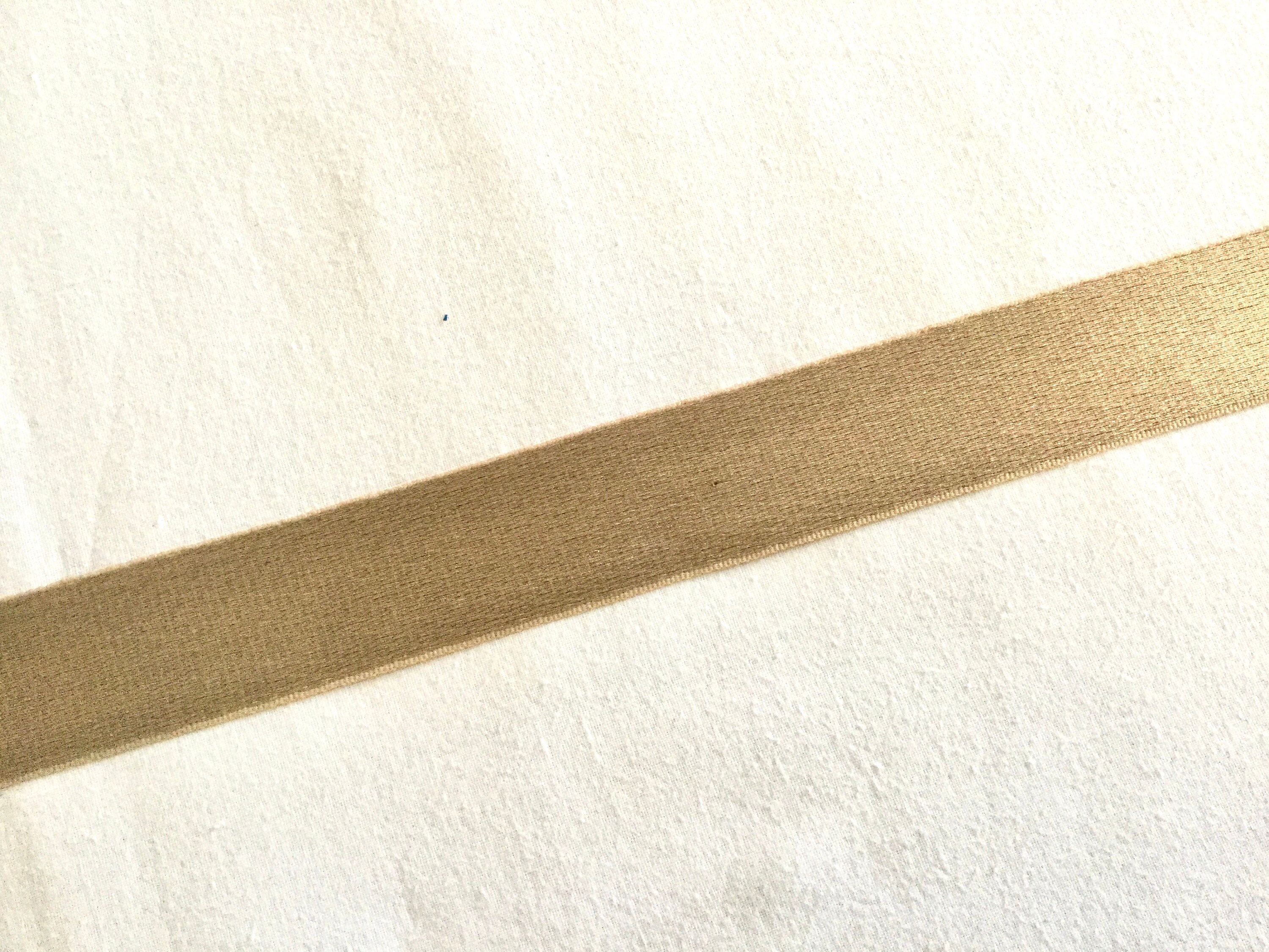 Thin gold metallic ribbon