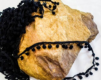 Zwarte pom pom trim met rand
