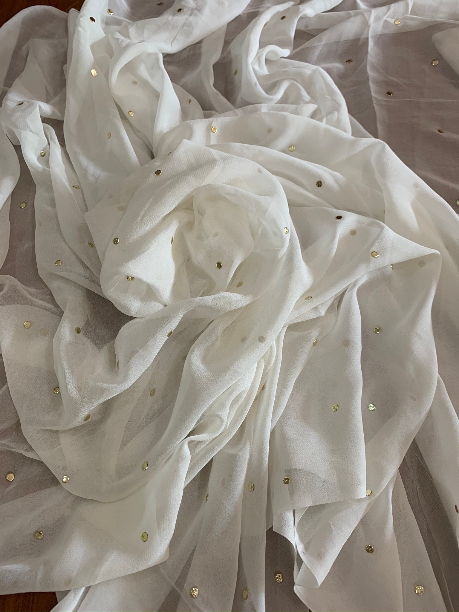 white dress with gold polka dots