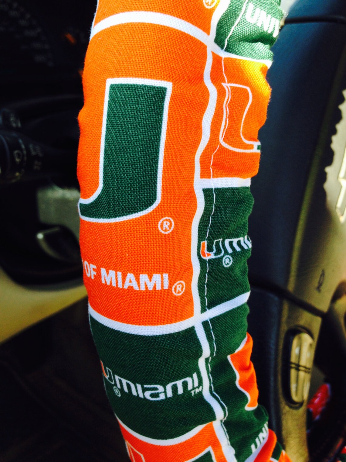 thumbnail image 2 of University Of Miami Hurricanes Steering Wheel Cover - NCAA Team Logo Polyester Cover 2 of 9